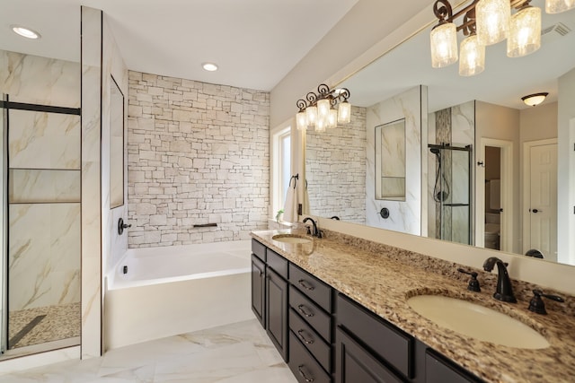 bathroom with vanity, a chandelier, and separate shower and tub