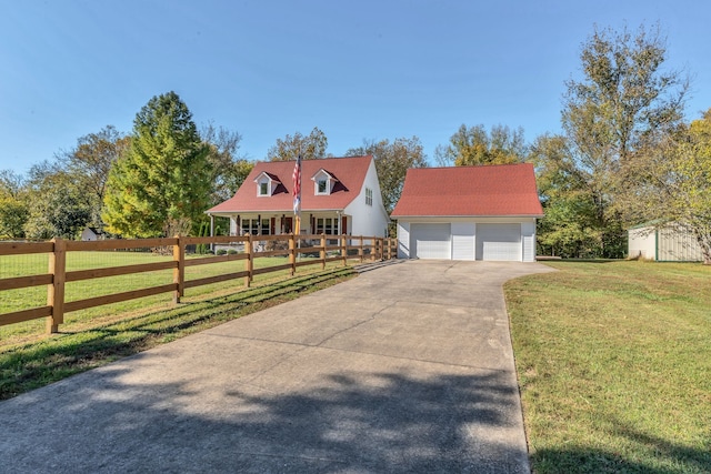 cape cod house featuring an outbuilding and a front lawn