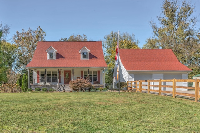 cape cod house featuring a front yard and a porch