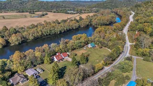 aerial view featuring a view of trees and a water view