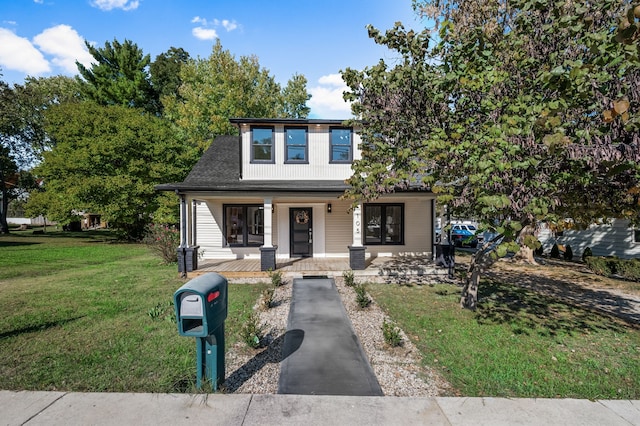 view of front of house featuring a front yard and covered porch