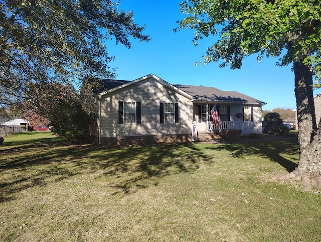 ranch-style house with a porch and a front lawn