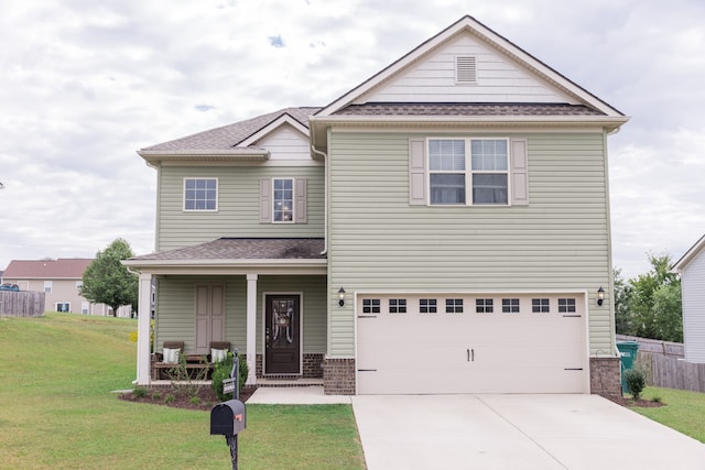 view of front of house with a front lawn and a garage