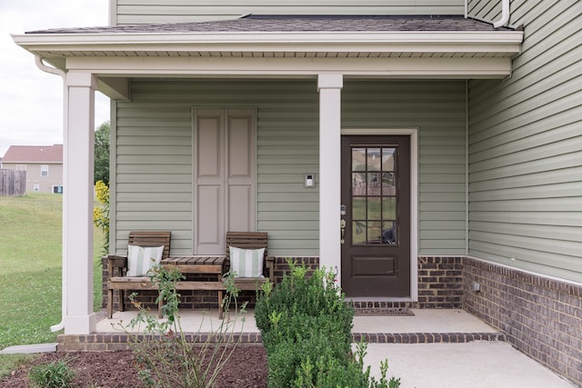 entrance to property featuring a porch