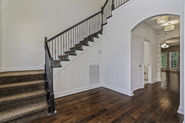 stairway with hardwood / wood-style flooring