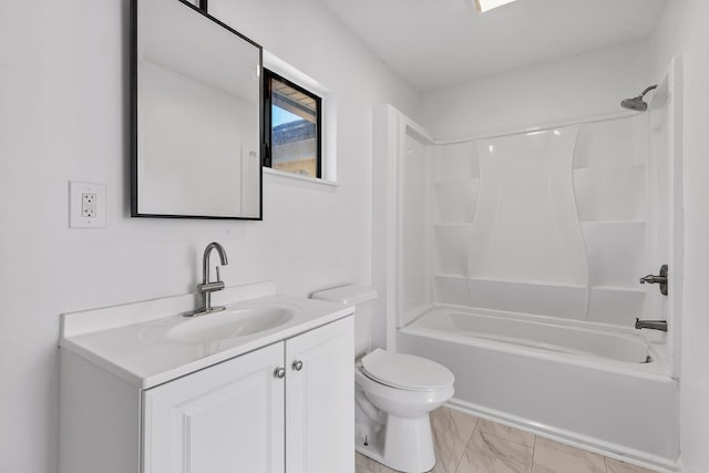 full bathroom with vanity, toilet, and  shower combination