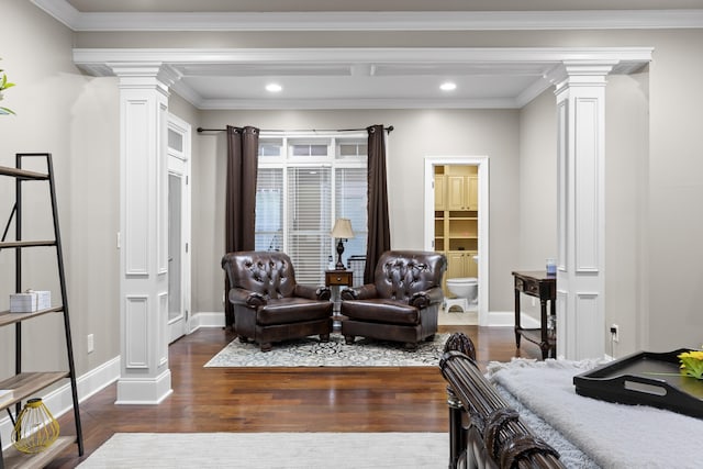 bedroom with dark wood-type flooring, crown molding, and decorative columns