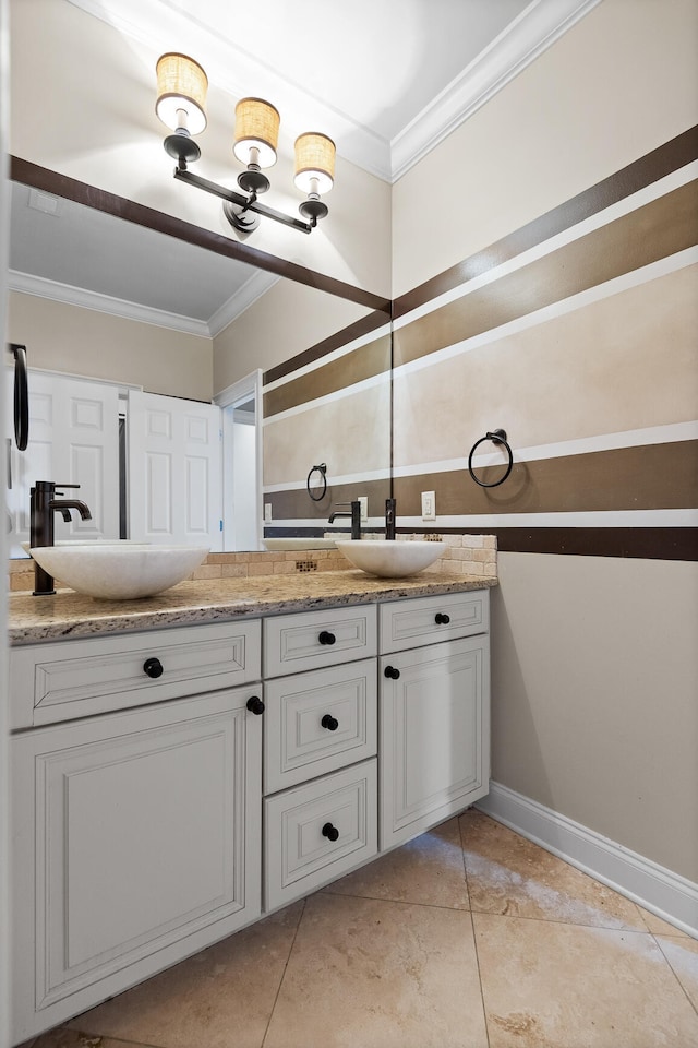 bathroom with vanity, crown molding, and tile patterned flooring