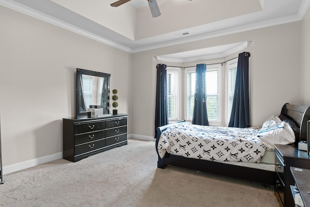 carpeted bedroom featuring multiple windows, ornamental molding, and ceiling fan