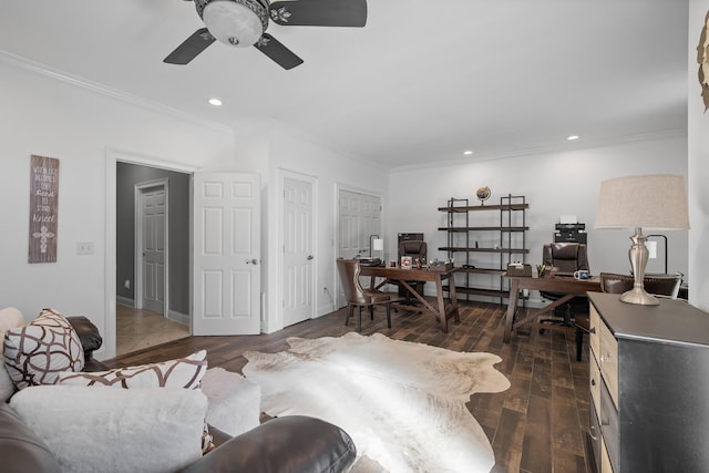 living room featuring ornamental molding, dark wood-type flooring, and ceiling fan