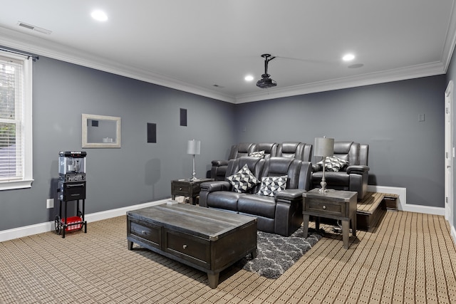 home theater featuring crown molding and light colored carpet