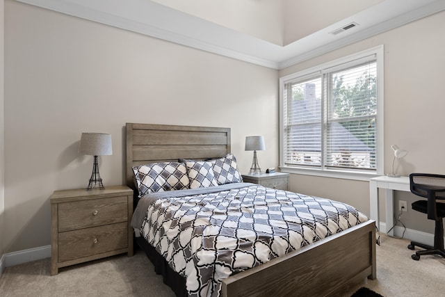 carpeted bedroom with crown molding