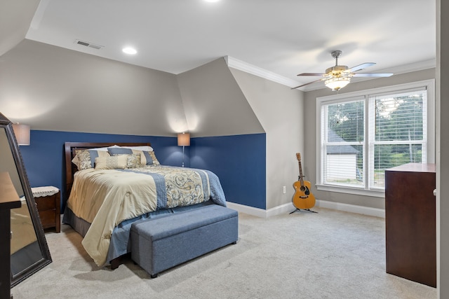 carpeted bedroom featuring ceiling fan, ornamental molding, and lofted ceiling