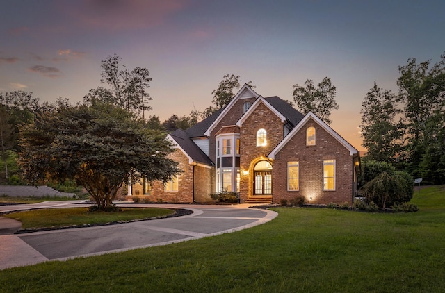 view of front of property with a lawn