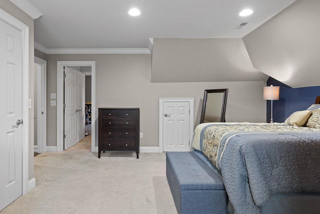 bedroom featuring ornamental molding, vaulted ceiling, and light carpet