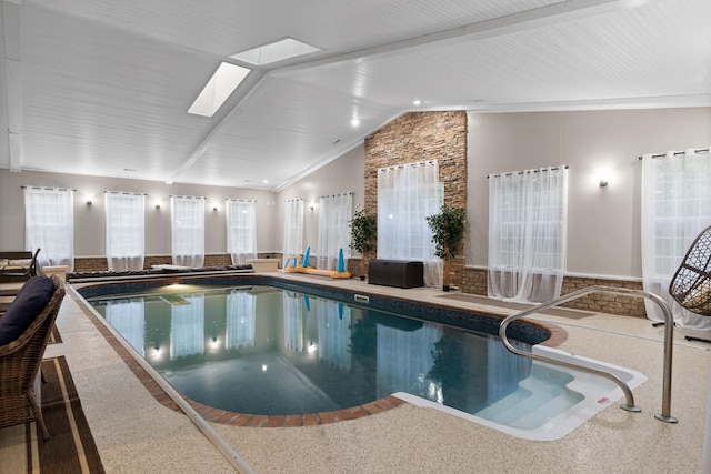 view of swimming pool featuring a skylight