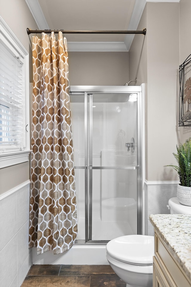 bathroom featuring toilet, crown molding, curtained shower, tile walls, and vanity