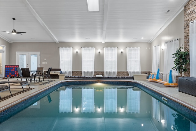 view of swimming pool with french doors and ceiling fan