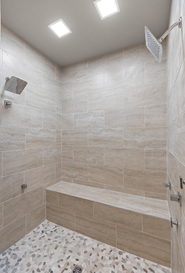 bathroom with tiled shower