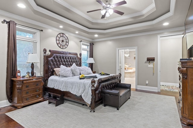 bedroom featuring multiple windows, ceiling fan, hardwood / wood-style flooring, and crown molding