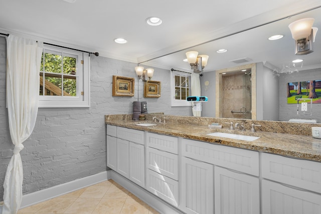 bathroom featuring vanity, tile patterned floors, walk in shower, and ornamental molding