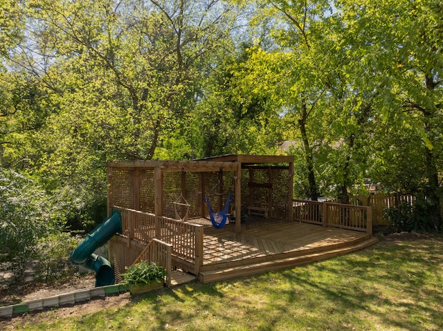 view of jungle gym featuring a yard and a deck