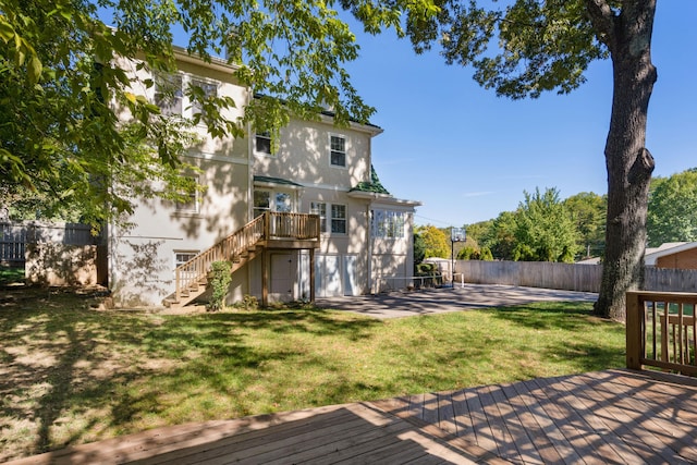 back of house featuring a yard and a patio