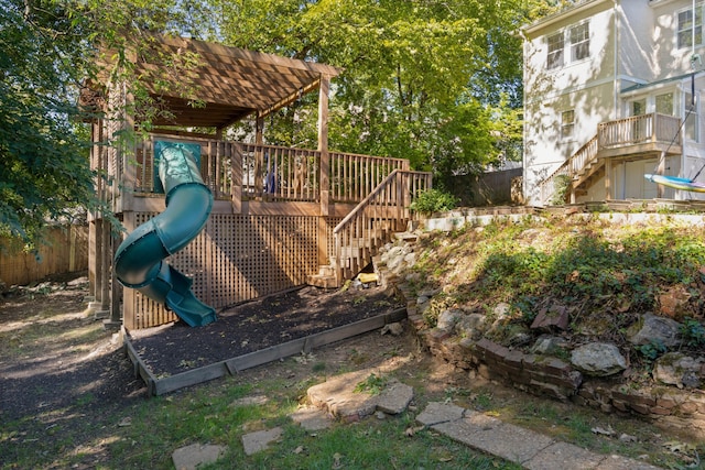 view of jungle gym featuring a wooden deck