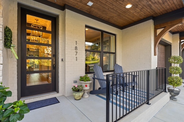 doorway to property featuring covered porch