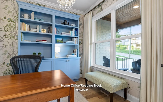 office area featuring hardwood / wood-style flooring, a healthy amount of sunlight, crown molding, and a chandelier