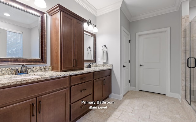 bathroom with vanity, crown molding, and an enclosed shower