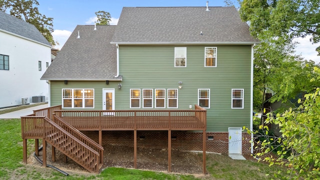 back of house with cooling unit and a deck