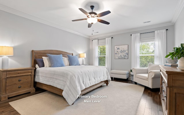 bedroom with ceiling fan, ornamental molding, multiple windows, and dark hardwood / wood-style floors