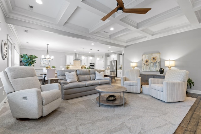 living room featuring beam ceiling, crown molding, light hardwood / wood-style flooring, and coffered ceiling