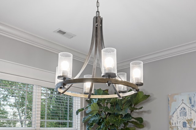 room details featuring ornamental molding and a chandelier