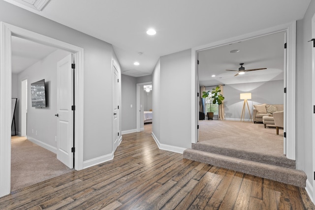 corridor with hardwood / wood-style flooring