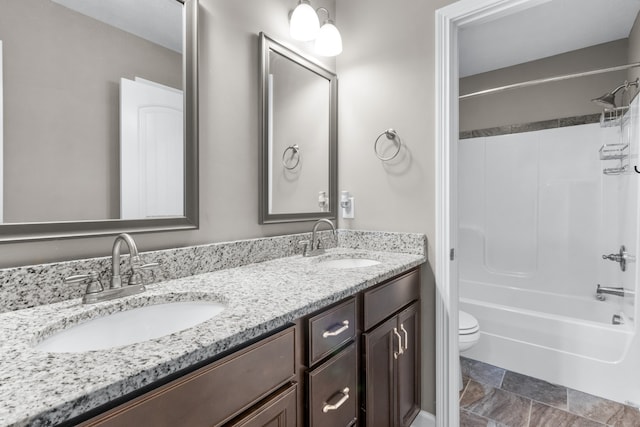 full bathroom featuring toilet, vanity, and shower / bath combination