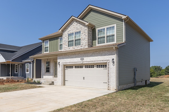 view of front of home with a front lawn and a garage