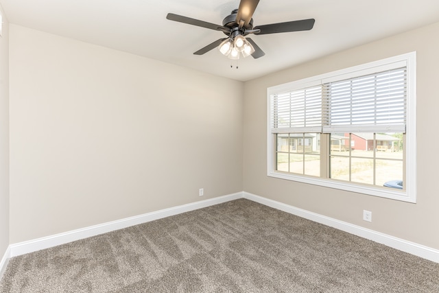 unfurnished room featuring ceiling fan and carpet