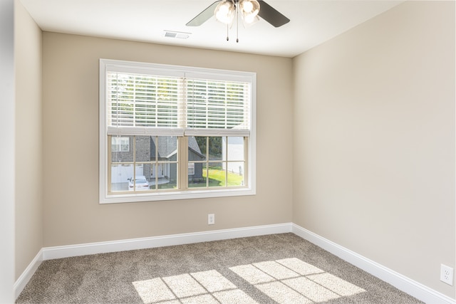 empty room with light carpet and ceiling fan