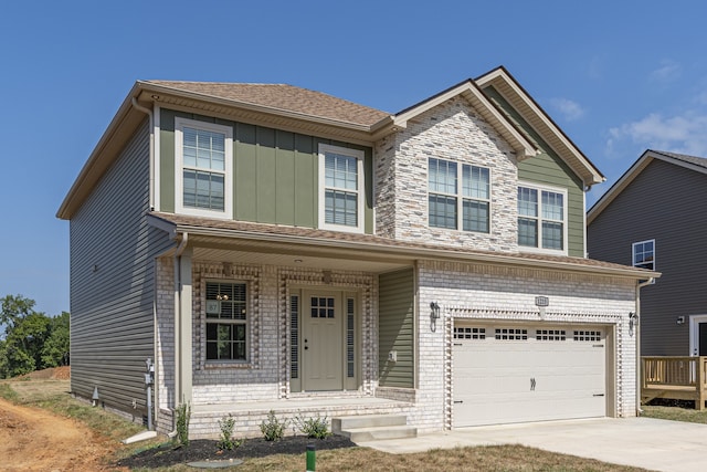 view of front facade featuring covered porch and a garage