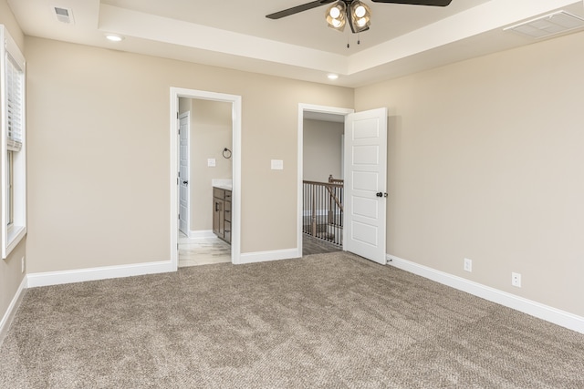 unfurnished bedroom featuring carpet and ceiling fan