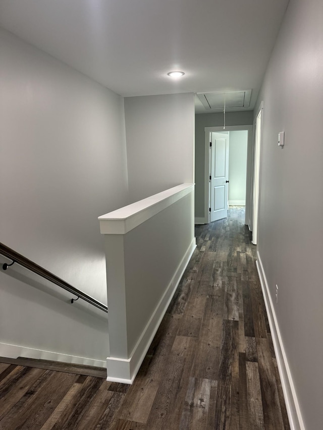 952 Greenwood Ave, Clarksville, TN 37040 - corridor featuring baseboards, attic access, dark wood-style flooring, and an upstairs landing
