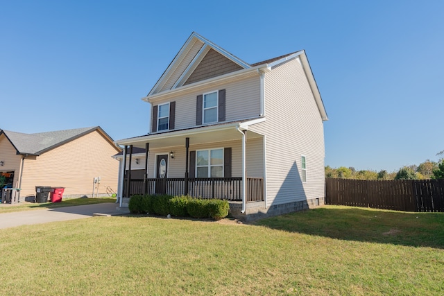 view of front of house featuring a front yard and a porch