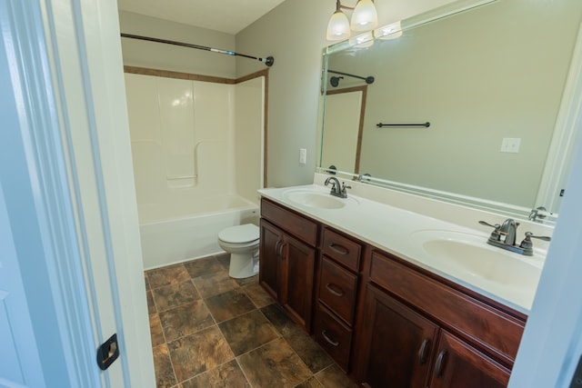 full bathroom featuring vanity, shower / washtub combination, and toilet