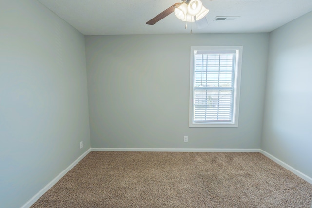 empty room with carpet flooring and ceiling fan