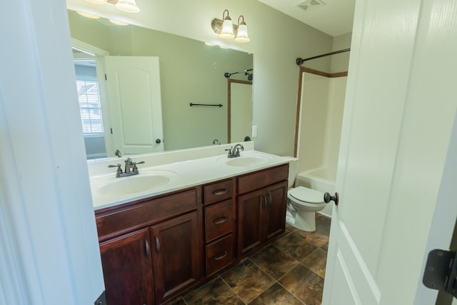 full bathroom featuring vanity, shower / washtub combination, and toilet