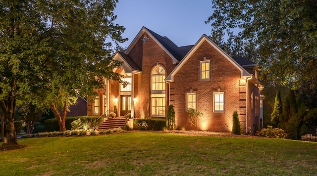 view of front of home with a lawn