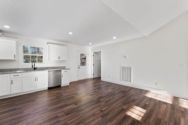 kitchen with stainless steel dishwasher, sink, white cabinetry, and dark hardwood / wood-style floors