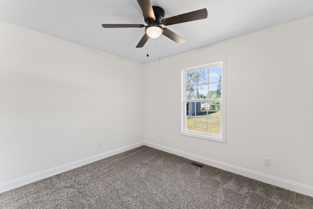 carpeted spare room with ceiling fan